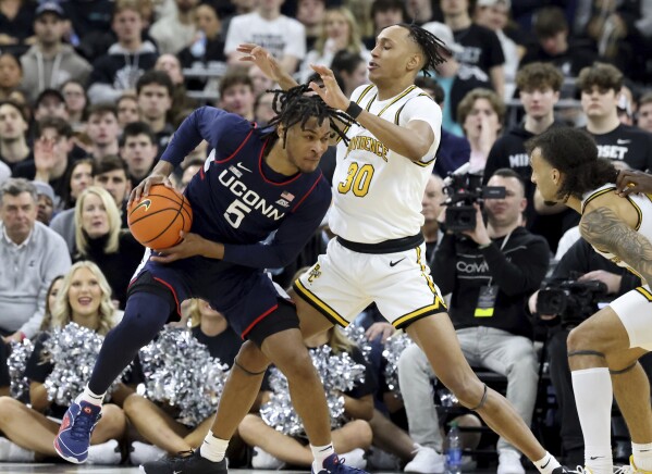 No. 2 UConn overcomes 15 2 deficit to beat Providence 74 60 and